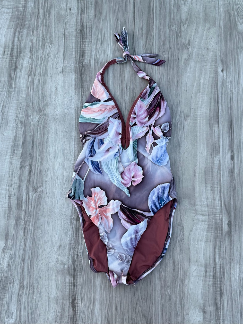 BCBGMAXAZRIA one-piece swimsuit features a mauve floral print